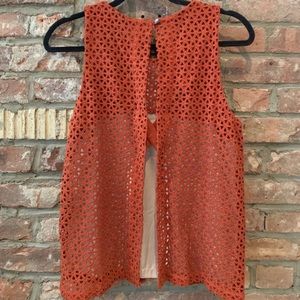 Crochet blouse with open back.
